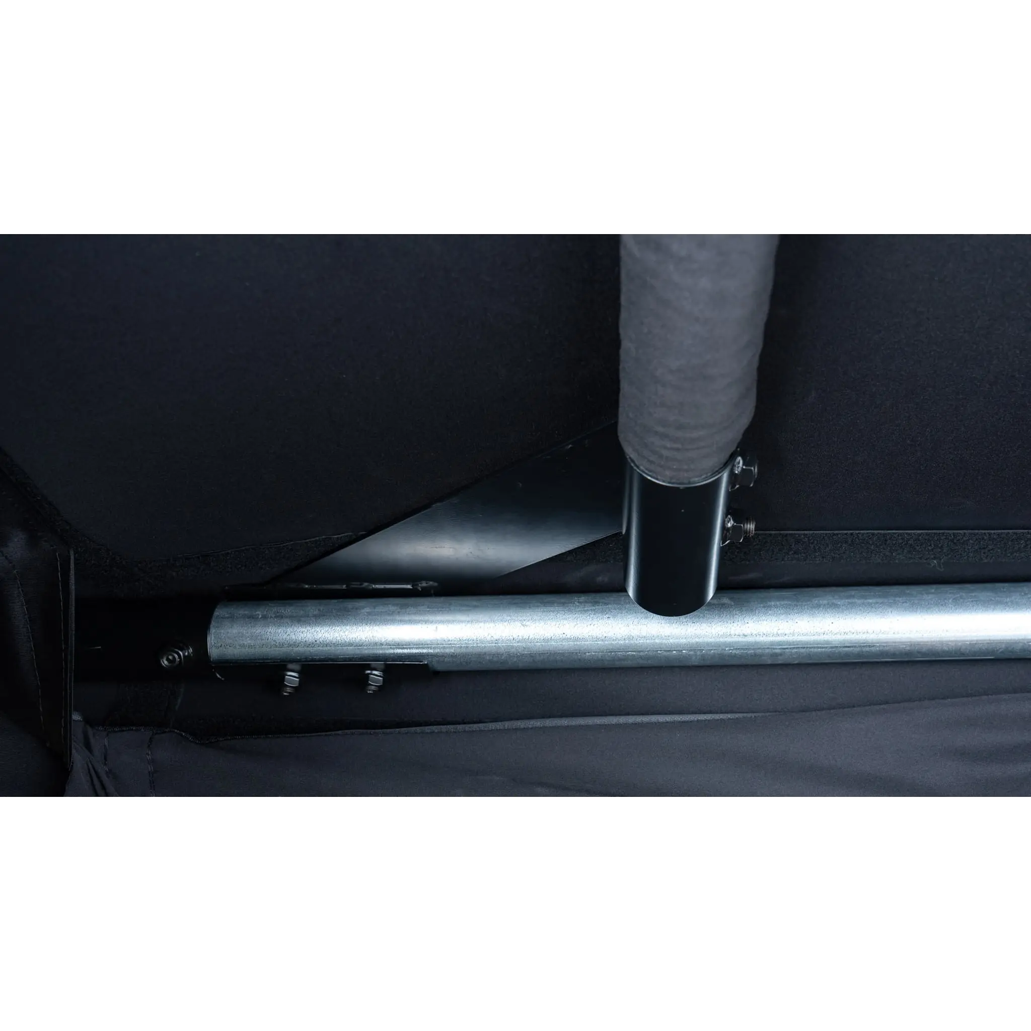 Close-up view of metal support beams and fabric material from a golf simulator enclosure kit. The image highlights the sturdy construction and attention to detail, showcasing the premium quality of the setup.