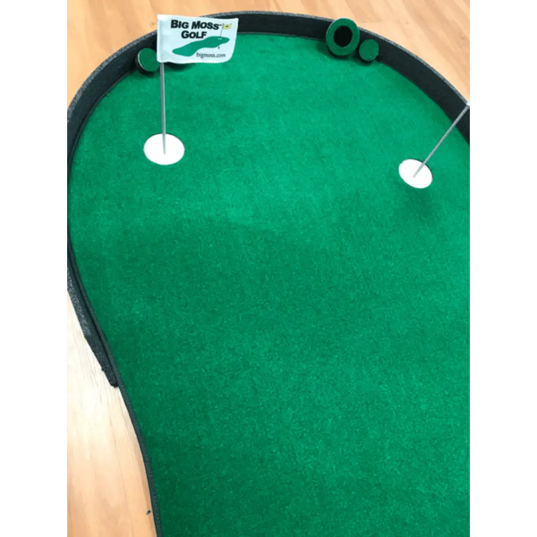 The Augusta EX Pro Putting Green with one hole and flag displayed on a hardwood floor