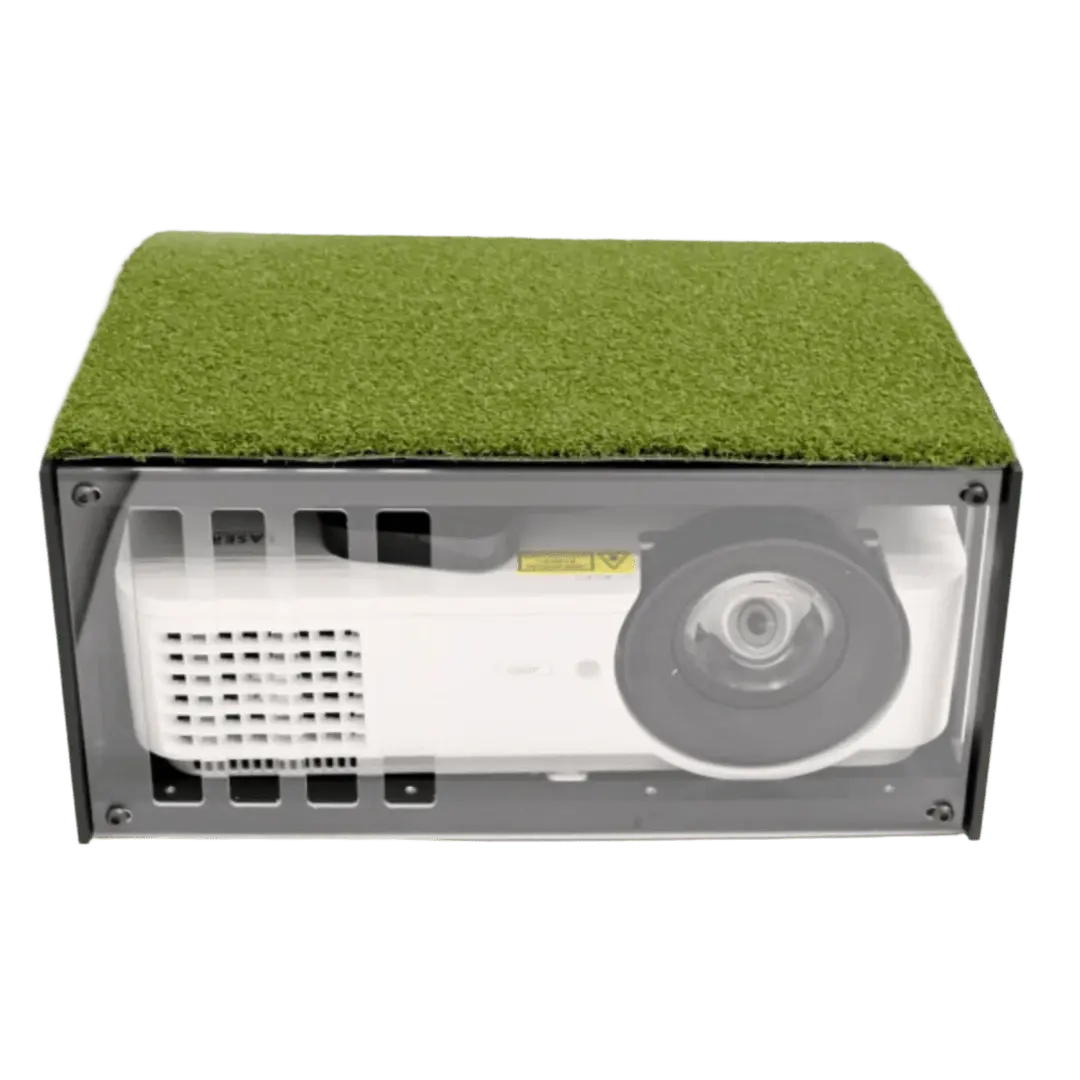 White projector in a floor-mounted enclosure with a clear front panel and a green artificial grass top