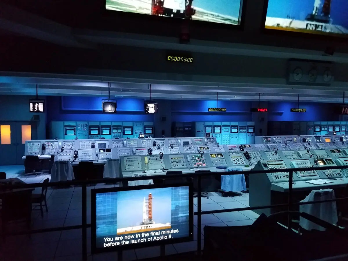 a room with many screens and monitors