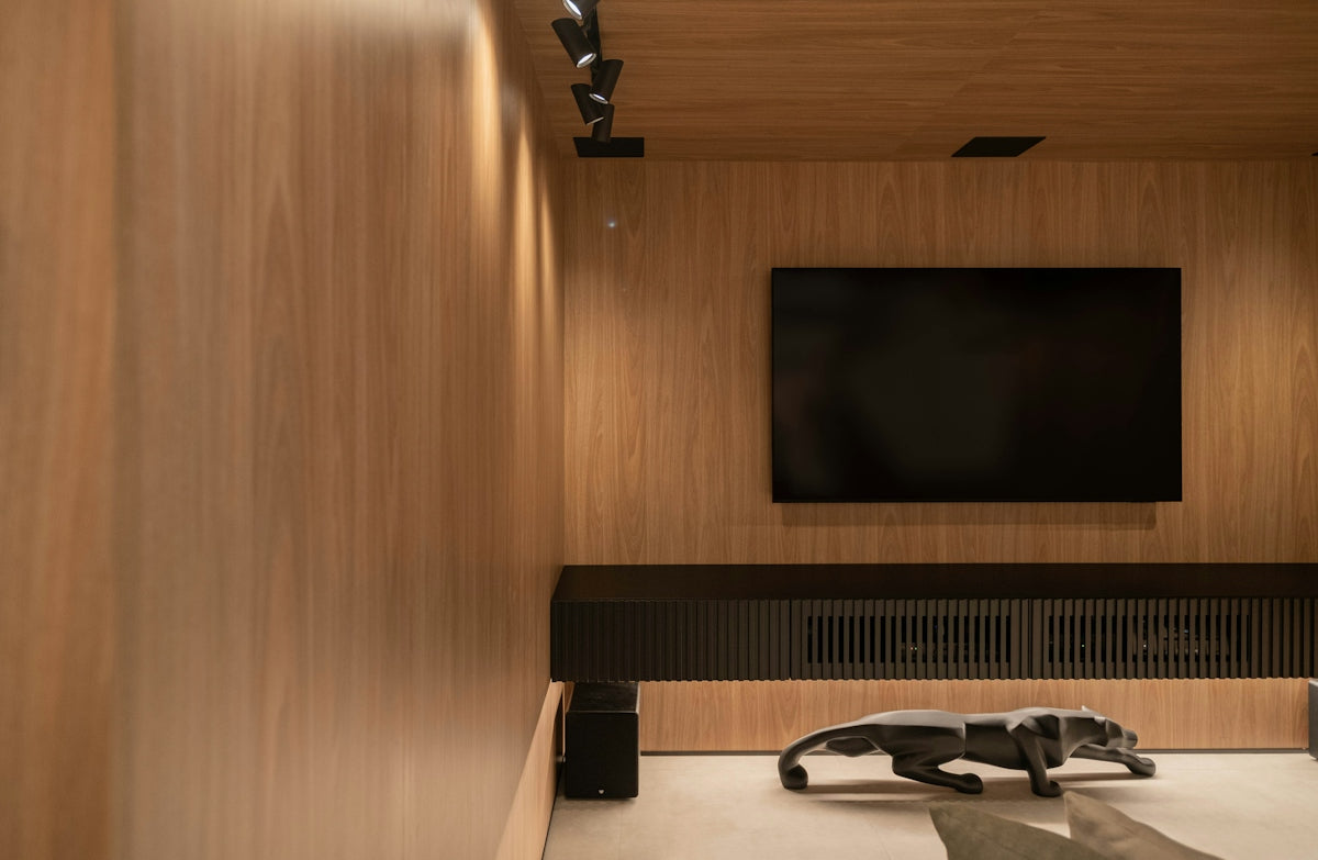 A modern entertainment room with wood paneling